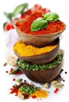 Natural ingredients of Max Boost supplement, featuring colorful herbs and spices like turmeric, chili powder, and green herbs, symbolizing health and vitality.